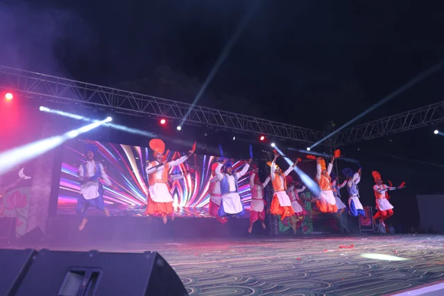 A lively group dance with colourful costumes